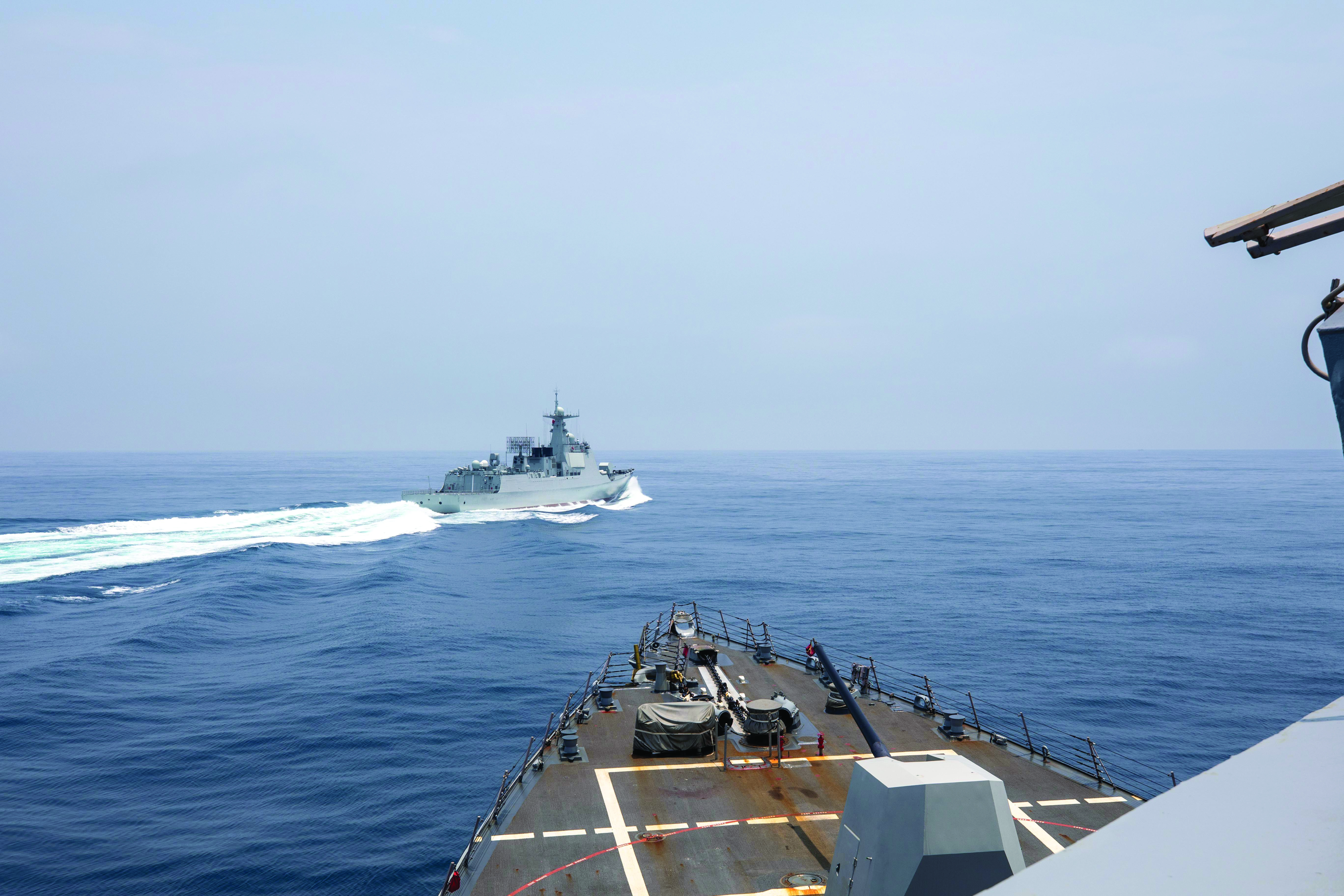 The USS Chung-Hoon observes People’s Liberation Army (Navy) LUYANG III DDG 132 execute unsafe maneuvers while conducting a routine south-to-north Taiwan Strait transit alongside the HMCS Montreal on 3 June 2023. (Credit: MC1 Andre T. Richard, U.S. Navy)